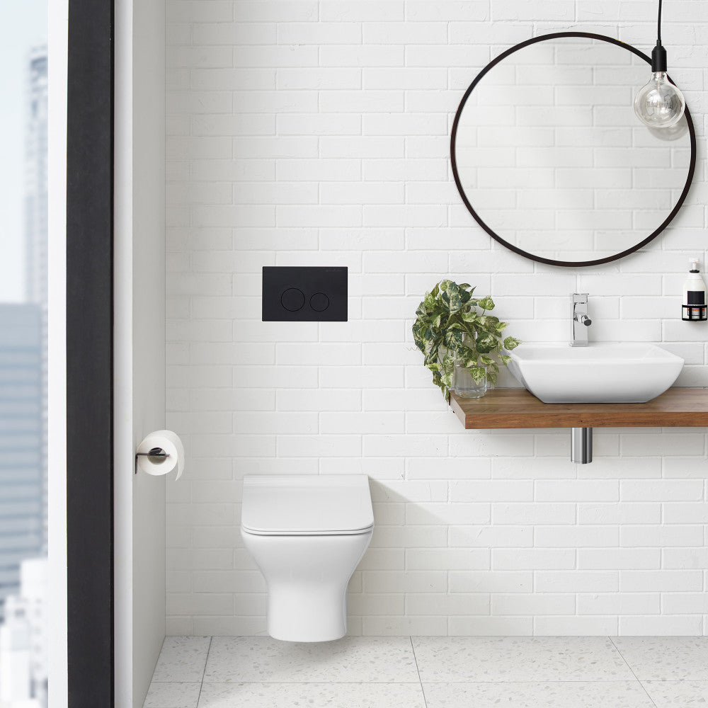 Monaco wall mount dual flush actuator plate in matte black, rectangular with two circular buttons.