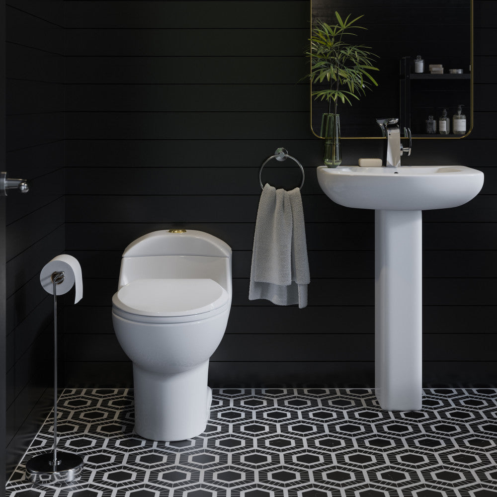Elongated one-piece toilet with dual flush, brushed gold hardware, white ceramic bowl.