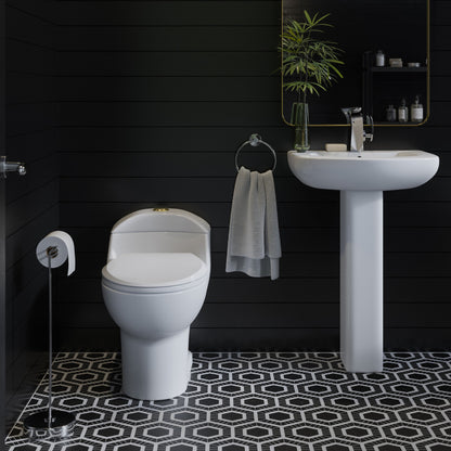 Elongated one-piece toilet with dual flush, brushed gold hardware, white ceramic bowl.
