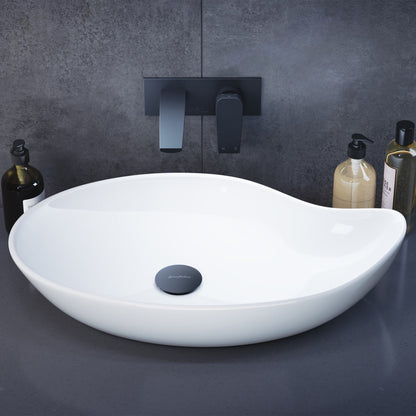Glossy white ceramic vessel sink 25.5-inch with round smooth design and centered drain hole.