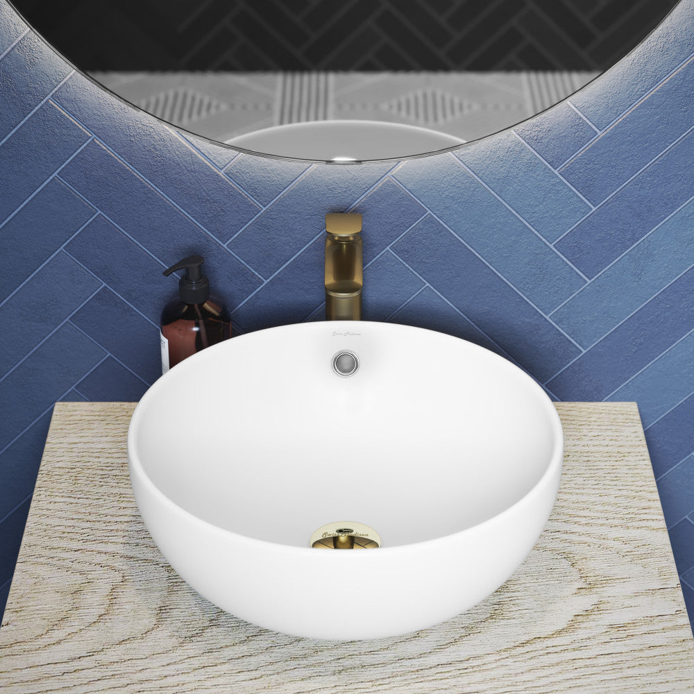 17-inch round vessel bathroom sink in matte white with centered drain and smooth curved edges.