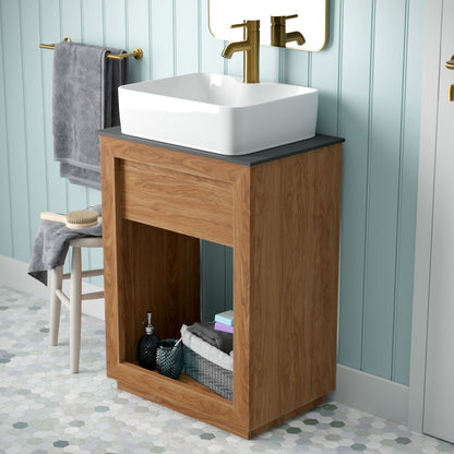 24-inch freestanding reclaimed wood vanity in natural teak with slate countertop and white vessel sink.
