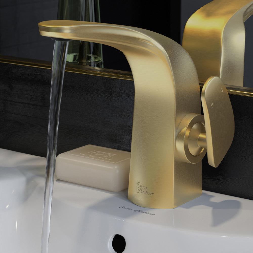 Single-handle bathroom faucet in brushed gold, Chateau collection, water flowing from spout.