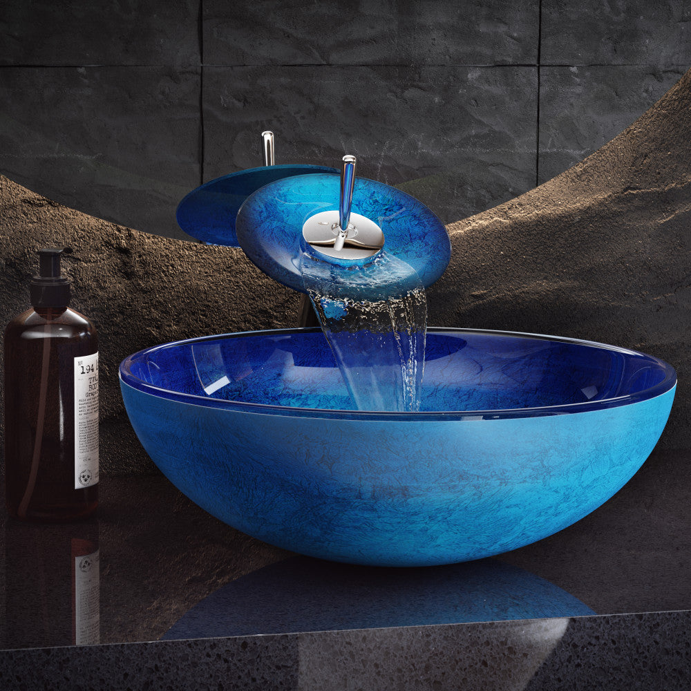 16.5-inch ocean blue glass vessel sink with matching waterfall faucet.