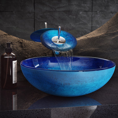 16.5-inch ocean blue glass vessel sink with matching waterfall faucet.