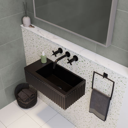 24" rectangular wall-mount bathroom sink in matte black with ribbed front and wall-mounted matte black faucet.