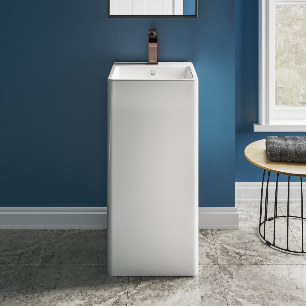 White one-piece pedestal sink with square basin and single faucet hole, freestanding bathroom fixture.