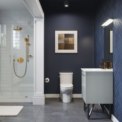 Elongated one-piece toilet with left side flush handle in white, modern bathroom setup.