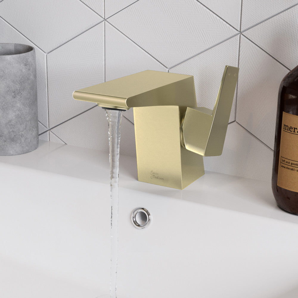 Single-handle bathroom faucet in brushed gold with square edges and flowing water.