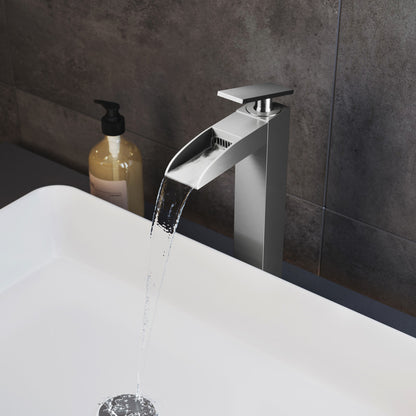 Single-handle bathroom faucet in brushed nickel with high arc waterfall spout.