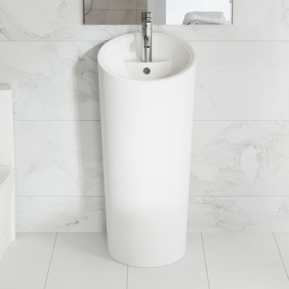 Circular one-piece pedestal sink in glossy white with integrated basin and single faucet hole.
