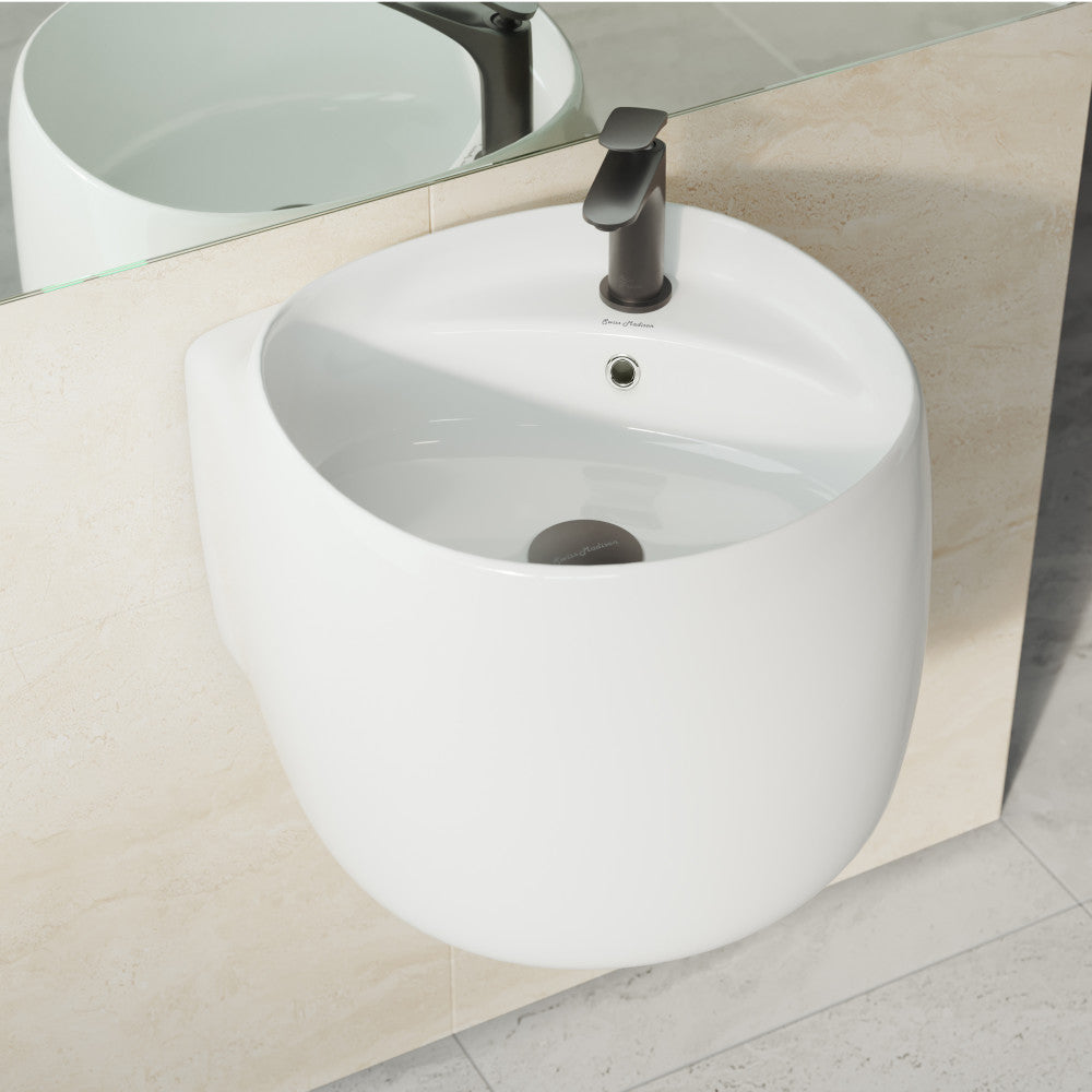 18-inch glossy white ceramic wall-mount bathroom sink with rounded basin and overflow hole.