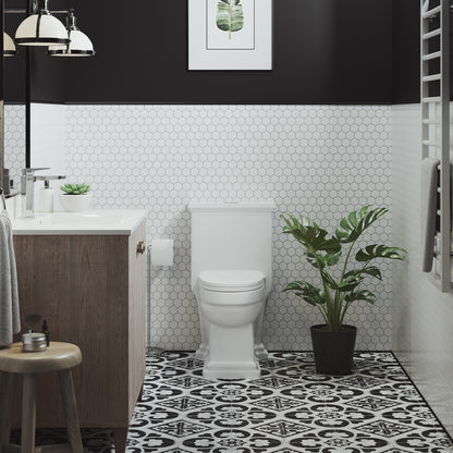 Elongated one-piece toilet with dual-flush, white, modern design, compact tank, and smooth curved edges.