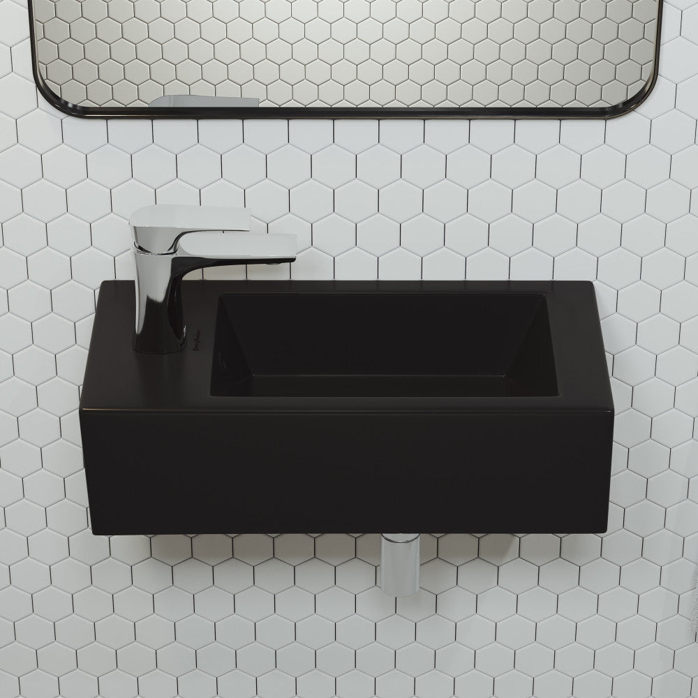 Rectangular matte black ceramic wall-hung sink with left side faucet mount and modern chrome faucet.