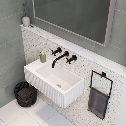24" wall-mount rectangular bathroom sink in matte white with black wall-mounted faucet and towel holder.