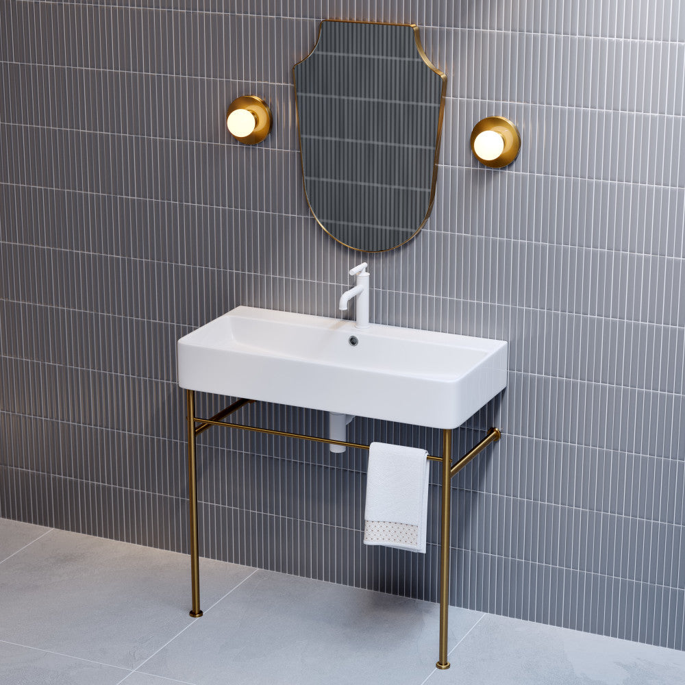 36-inch white ceramic console sink with brushed gold legs and integrated single-handle faucet.