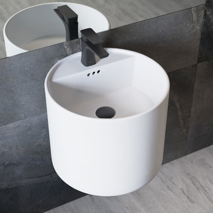 18-inch round wall-mount bathroom sink in white with integrated faucet and overflow hole.
