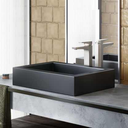Matte black rectangular ceramic vessel sink, flat edges, modern minimalist design.