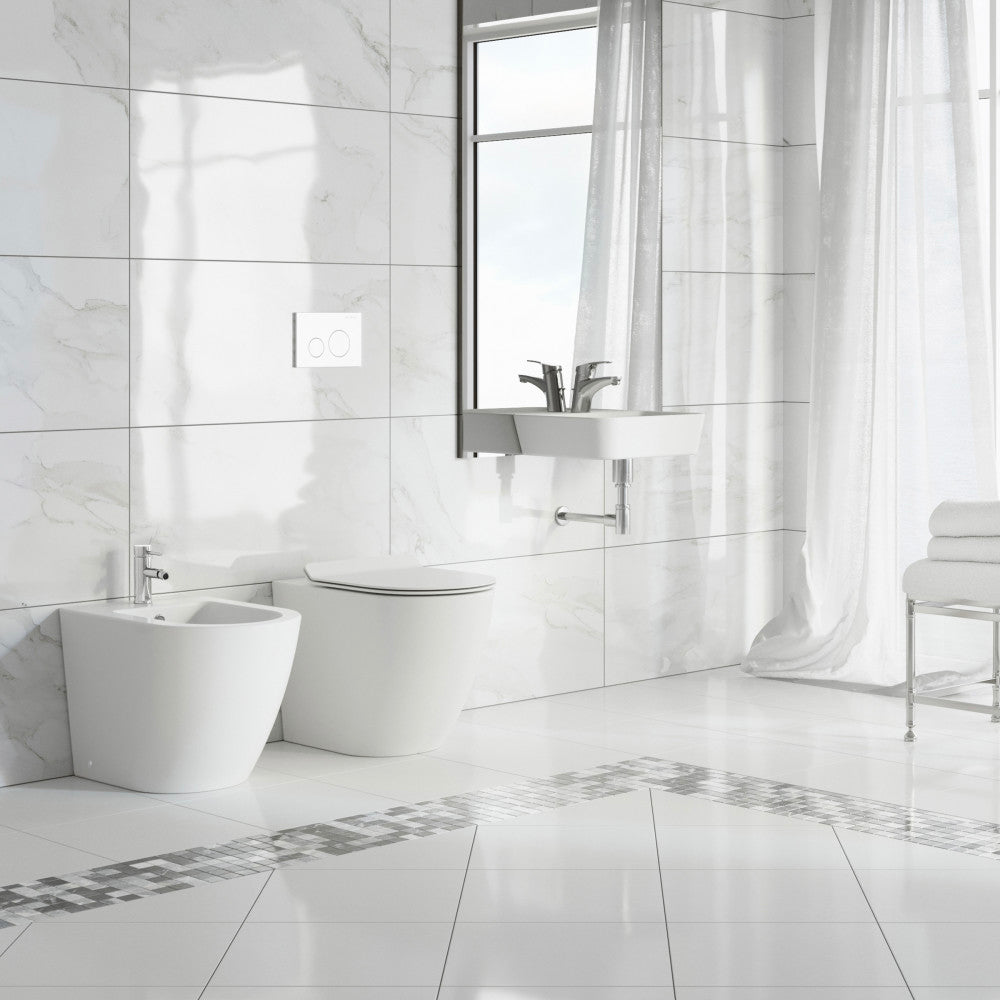 Floor-mount classic bidet in glossy white, modern design with chrome faucet.