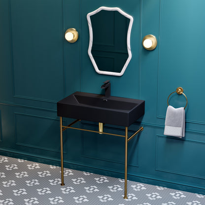 30-inch ceramic console sink in matte black with brushed gold legs, rectangular basin, and wall-mounted faucet.
