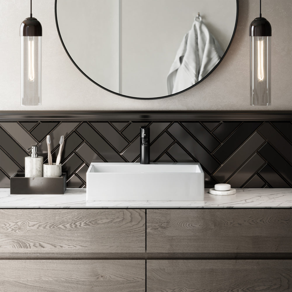Rectangular white ceramic vessel sink with clean modern lines on wooden vanity with black faucet.