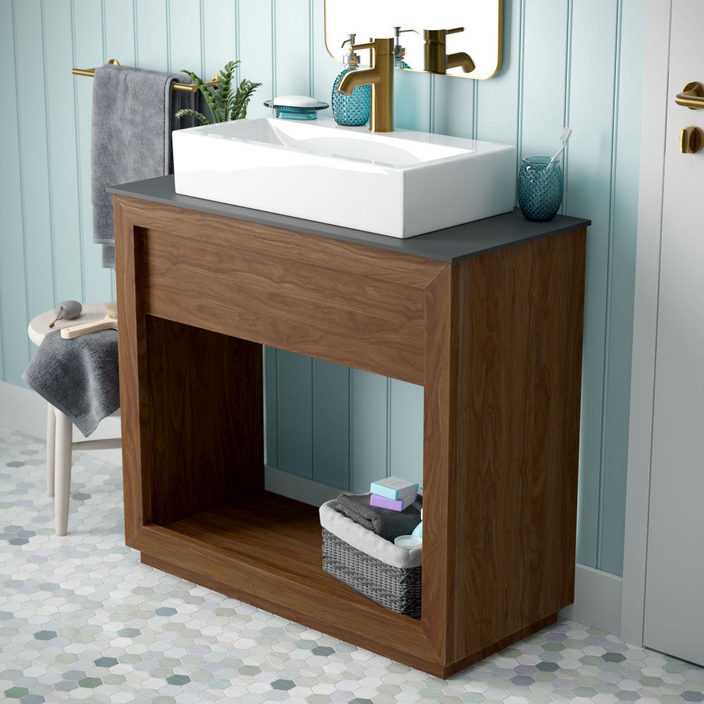36-inch freestanding walnut bathroom vanity with slate countertop and single hole vessel sink.