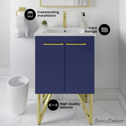 24-inch freestanding navy blue bathroom vanity with white sink top, gold hardware, and gold legs, soft-close doors.