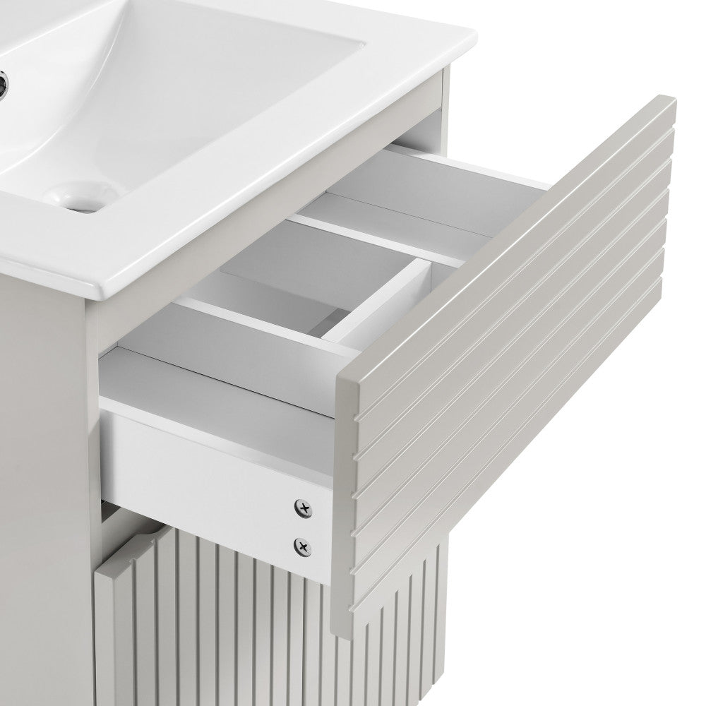 24-inch freestanding bathroom vanity in shell with single sink and soft-close drawer.