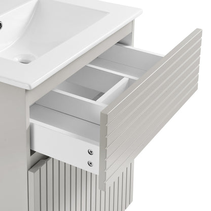 24-inch freestanding bathroom vanity in shell with single sink and soft-close drawer.