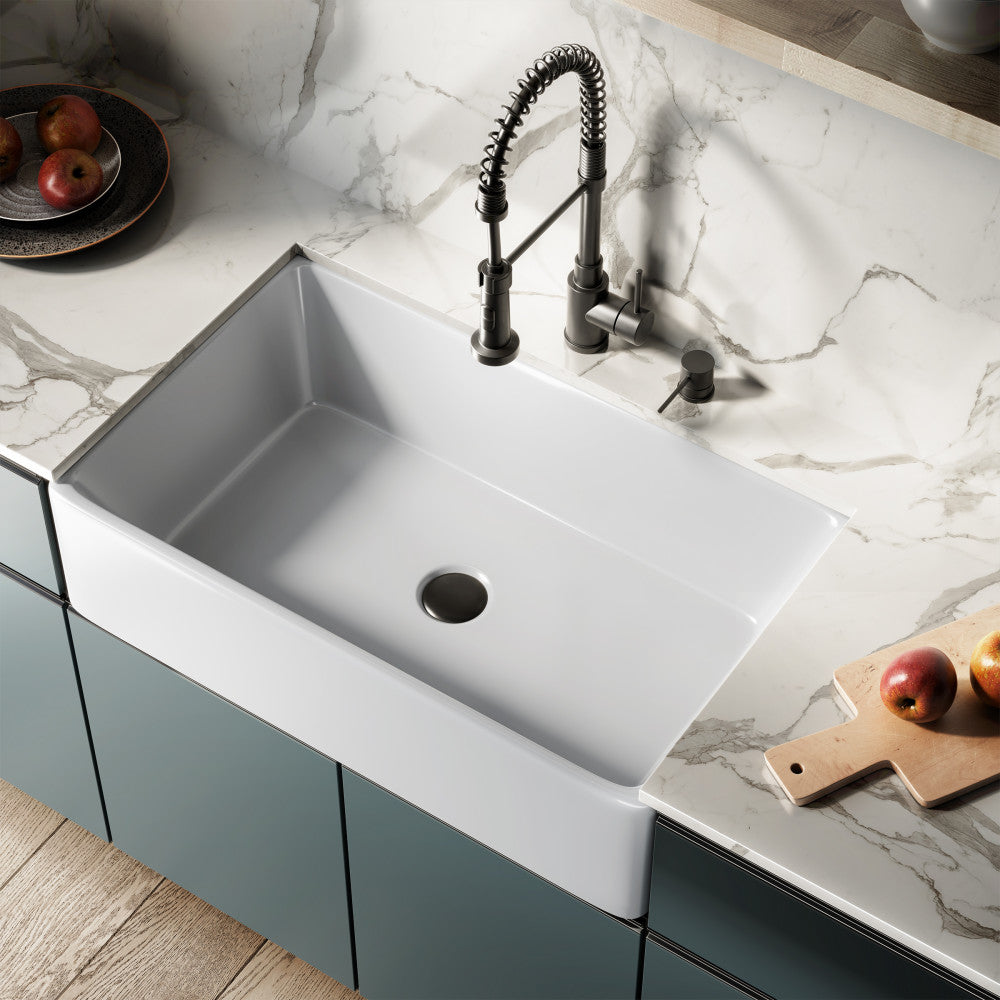 33 x 20 white ceramic farmhouse kitchen sink with apron front and modern black spring coil faucet.