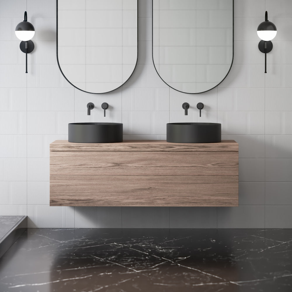 16.5" round vessel bathroom sink in matte black, countertop installation.