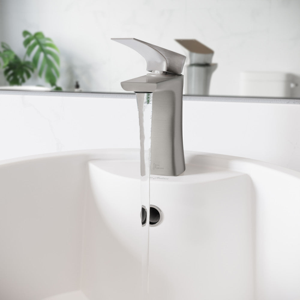 Single-handle bathroom faucet in brushed nickel, sleek curved spout, water flowing into white vessel sink.