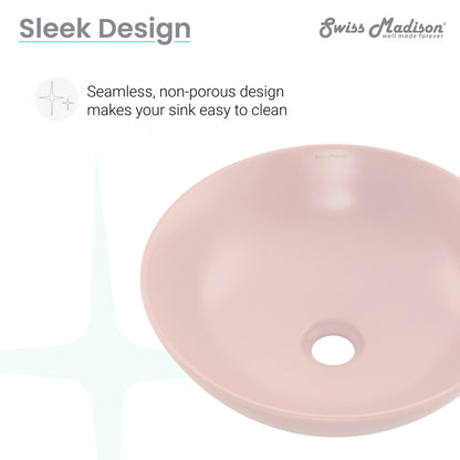 Round vessel bathroom sink in matte pink ceramic with smooth, seamless design and center drain hole.