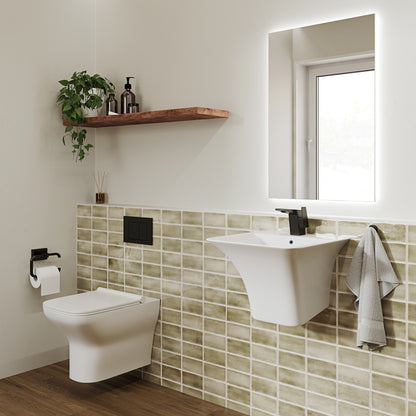 21" wall-mount bathroom sink in white ceramic with black single-handle faucet and towel holder.