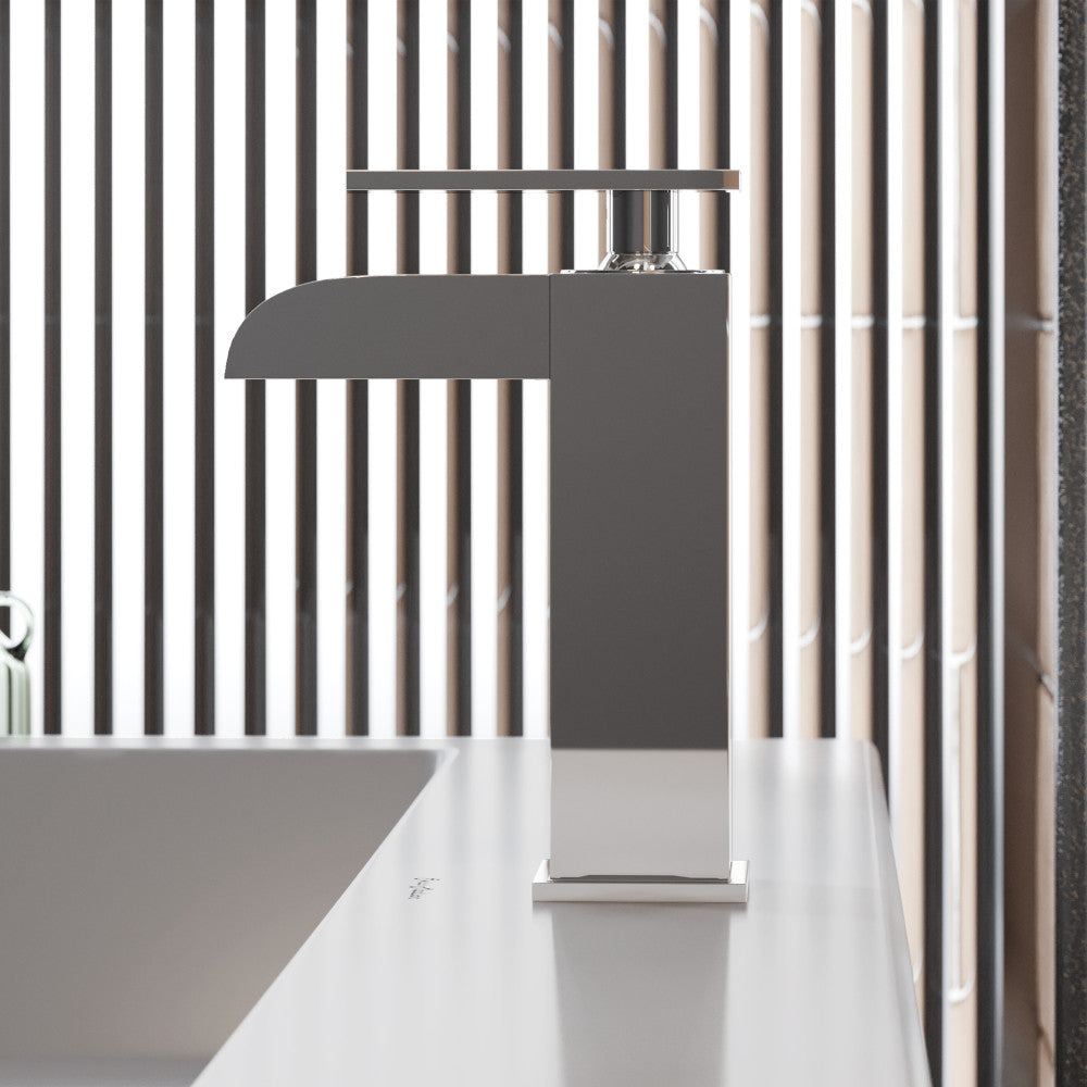 Single-handle waterfall bathroom faucet in chrome with sleek modern design.