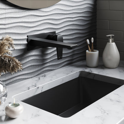 21" rectangular undermount bathroom sink in matte black with marble countertop and matte black wall-mounted faucet.