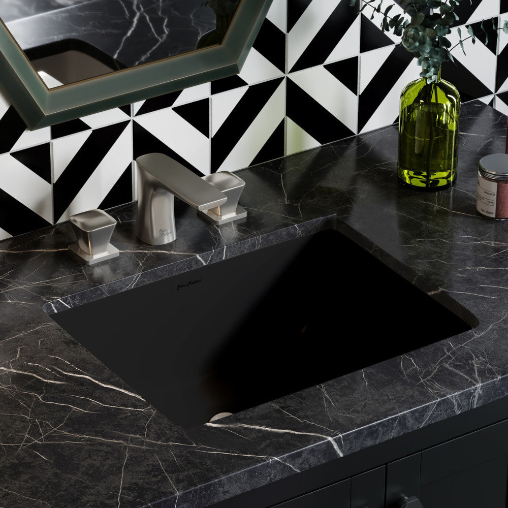 18.5" undermount rectangular bathroom sink in matte black with black marble countertop and silver faucet.