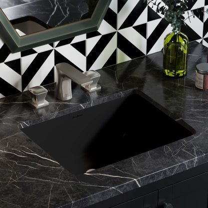 18.5" undermount rectangular bathroom sink in matte black with black marble countertop and silver faucet.