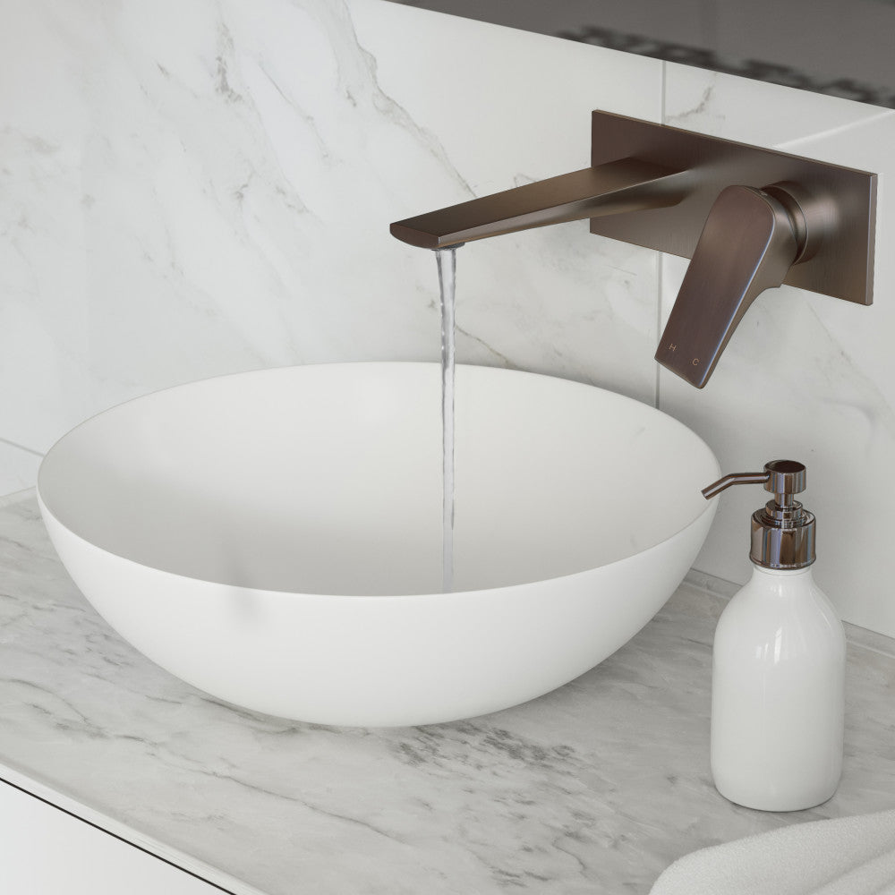 Single-handle wall-mount bathroom faucet in oil rubbed bronze with modern flat spout and lever handle.