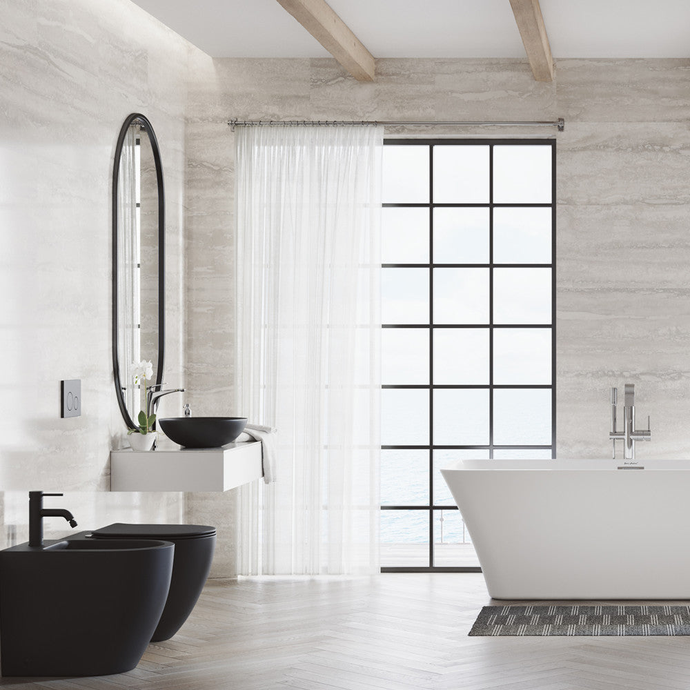 Elongated back-to-wall toilet bowl in white with skirted trapway, modern minimalist bathroom design.