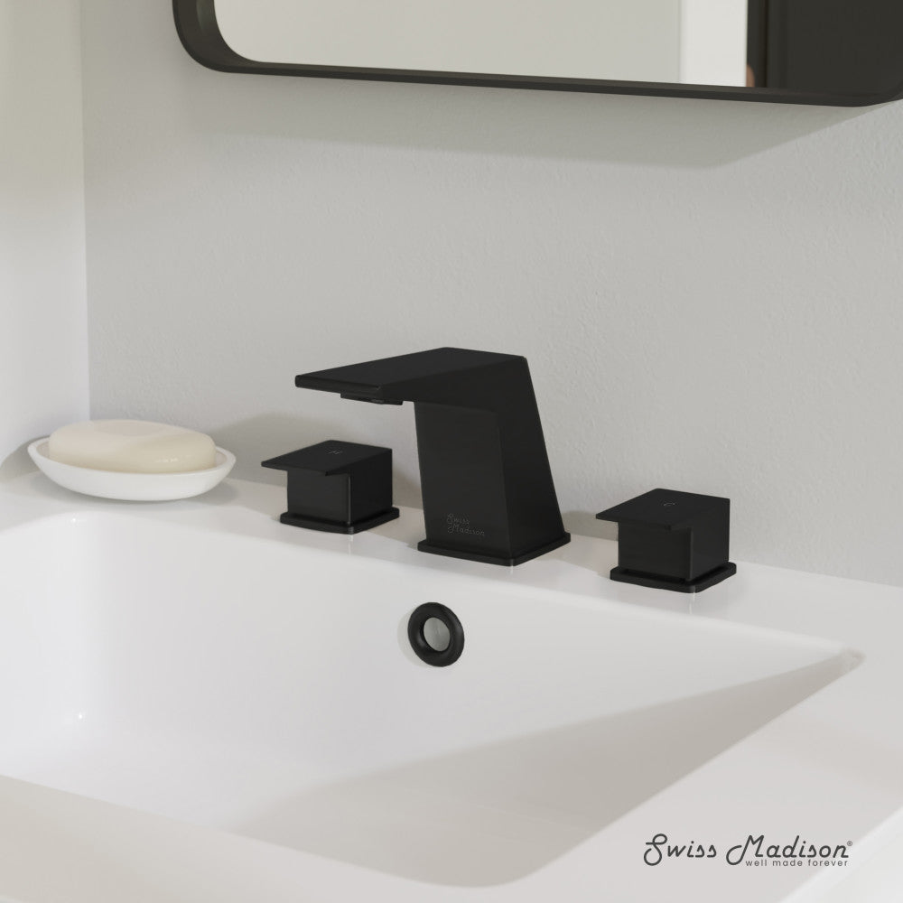 Widespread bathroom faucet in matte black with two square handles and angular spout on white countertop.