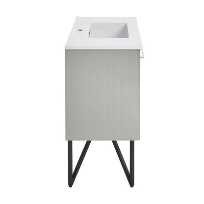 36-inch freestanding gray bathroom vanity with white sink top and metal leg supports.