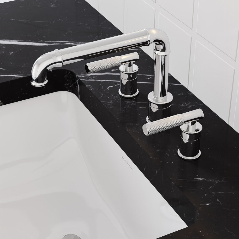 Widespread bathroom faucet in chrome with sleek cylindrical handles on black marble countertop.