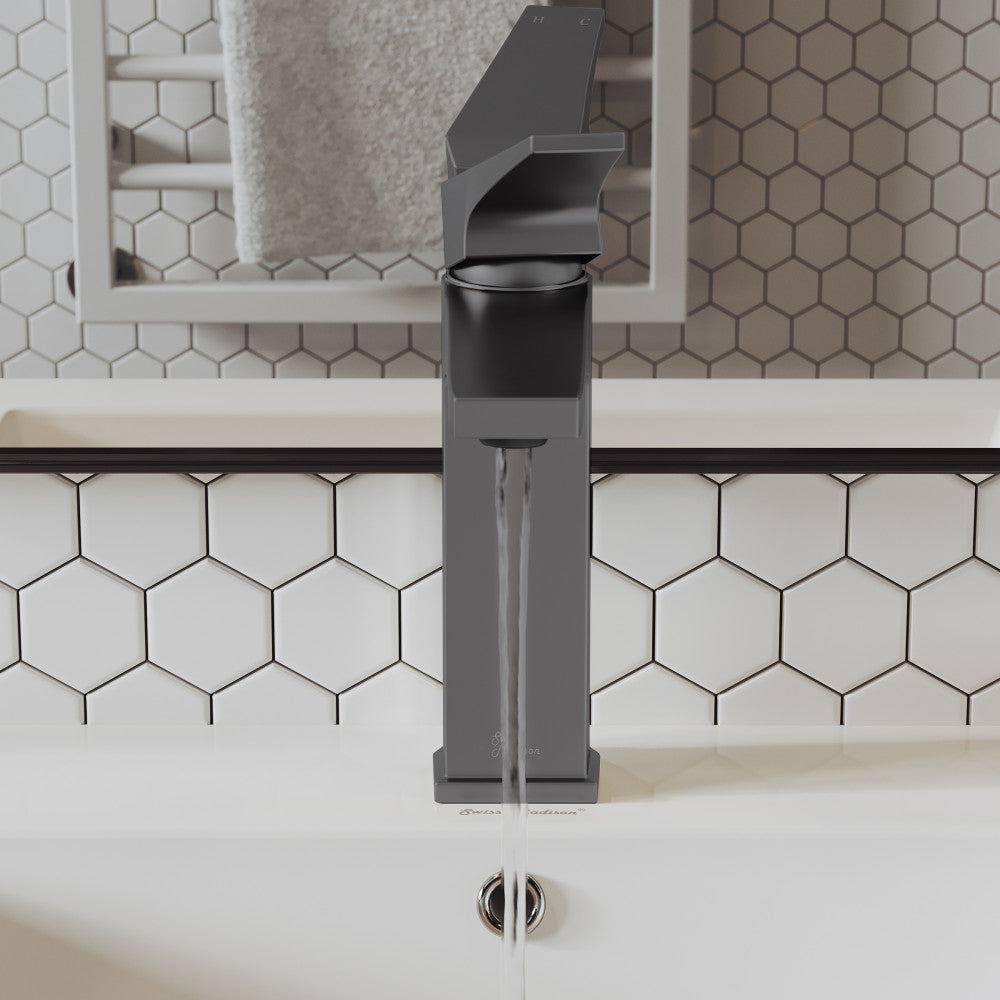 Single-handle bathroom faucet in gunmetal gray with sleek modern design and water flowing from spout.