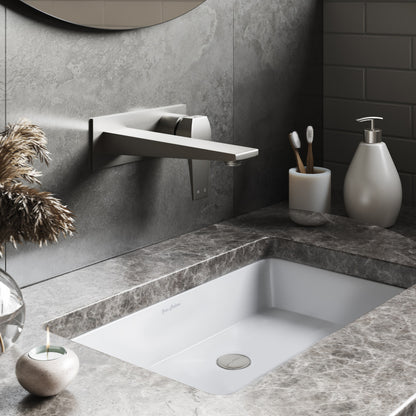 Rectangular under-mount bathroom sink in white with gray marble countertop.