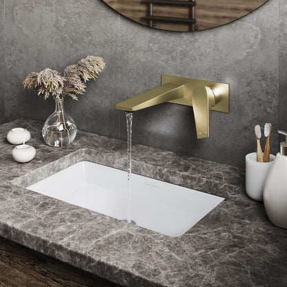 Single-handle wall-mount bathroom faucet in brushed gold with water flowing from spout.