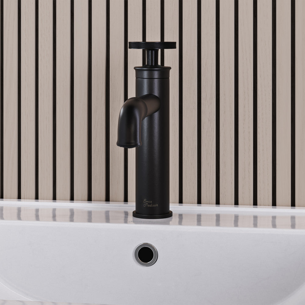 Single-handle bathroom faucet in matte black with wheel handle and tall vessel spout.