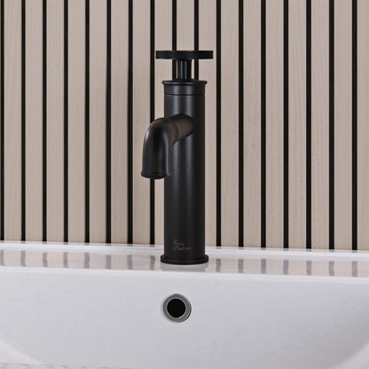 Single-handle bathroom faucet in matte black with wheel handle and tall vessel spout.