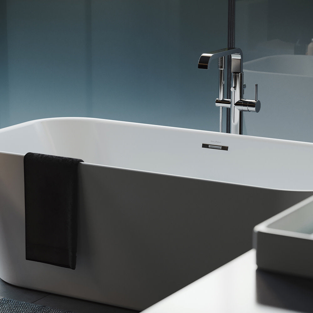 Freestanding soaking bathtub 67 inch in matte black and white with chrome floor-mounted faucet.