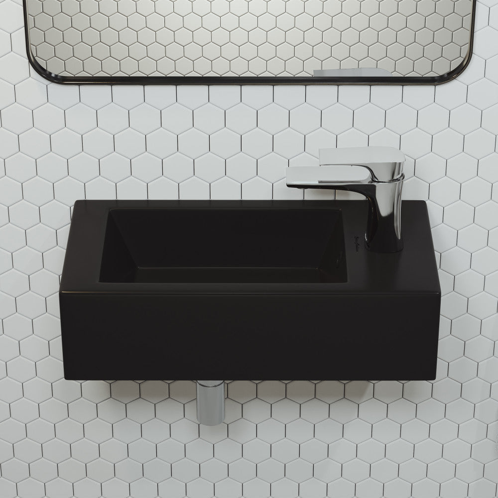 Matte black rectangular wall-hung ceramic sink with right side faucet mount, minimalist design.